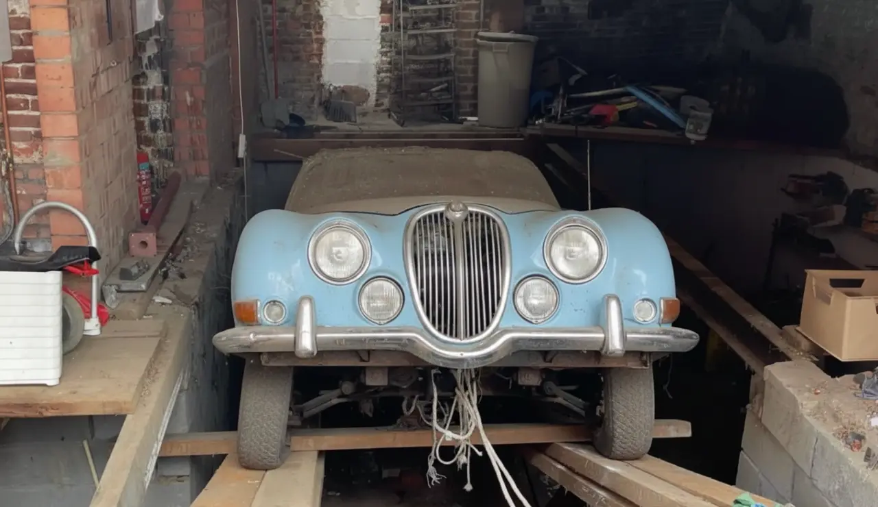 Antique Dealer Finds 1964 Jaguar Concealed Under Garage Floor in Kessel-Lo
