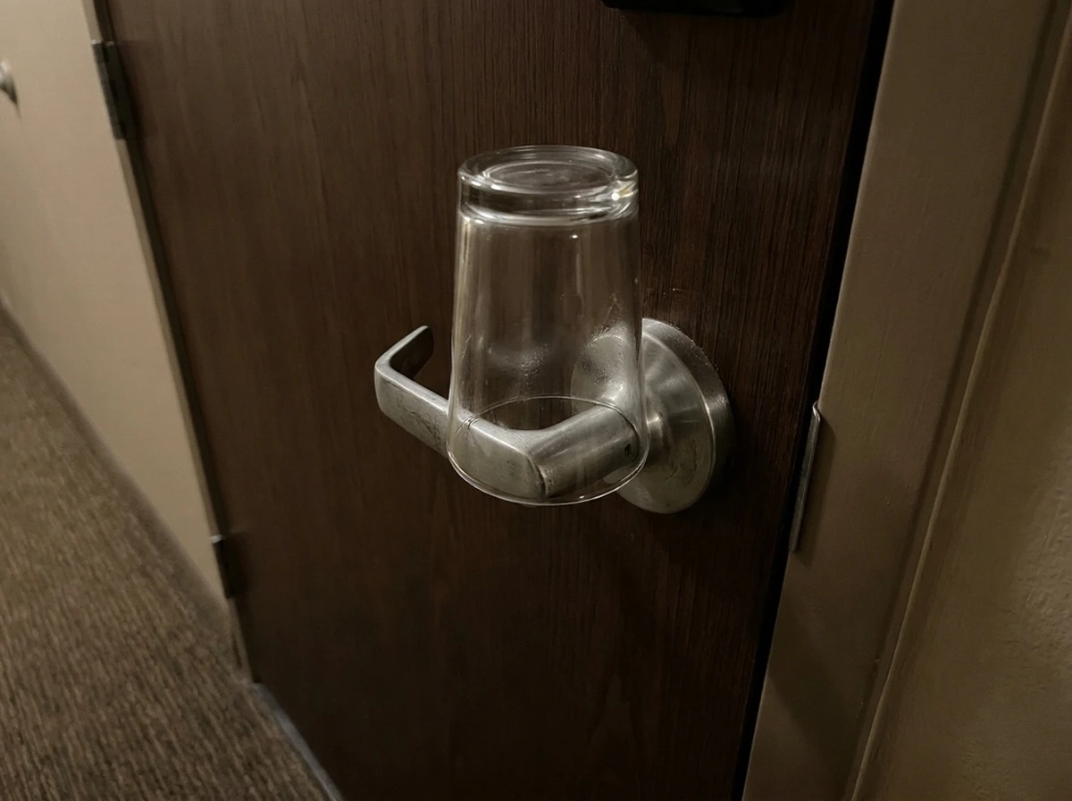 Seasoned Travelers Are Placing Cups on Hotel Door Handles Before Bed—Here’s the Clever Reason Why