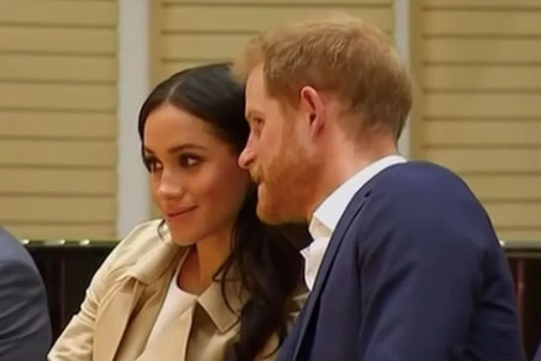 Harry and Meghan smiling