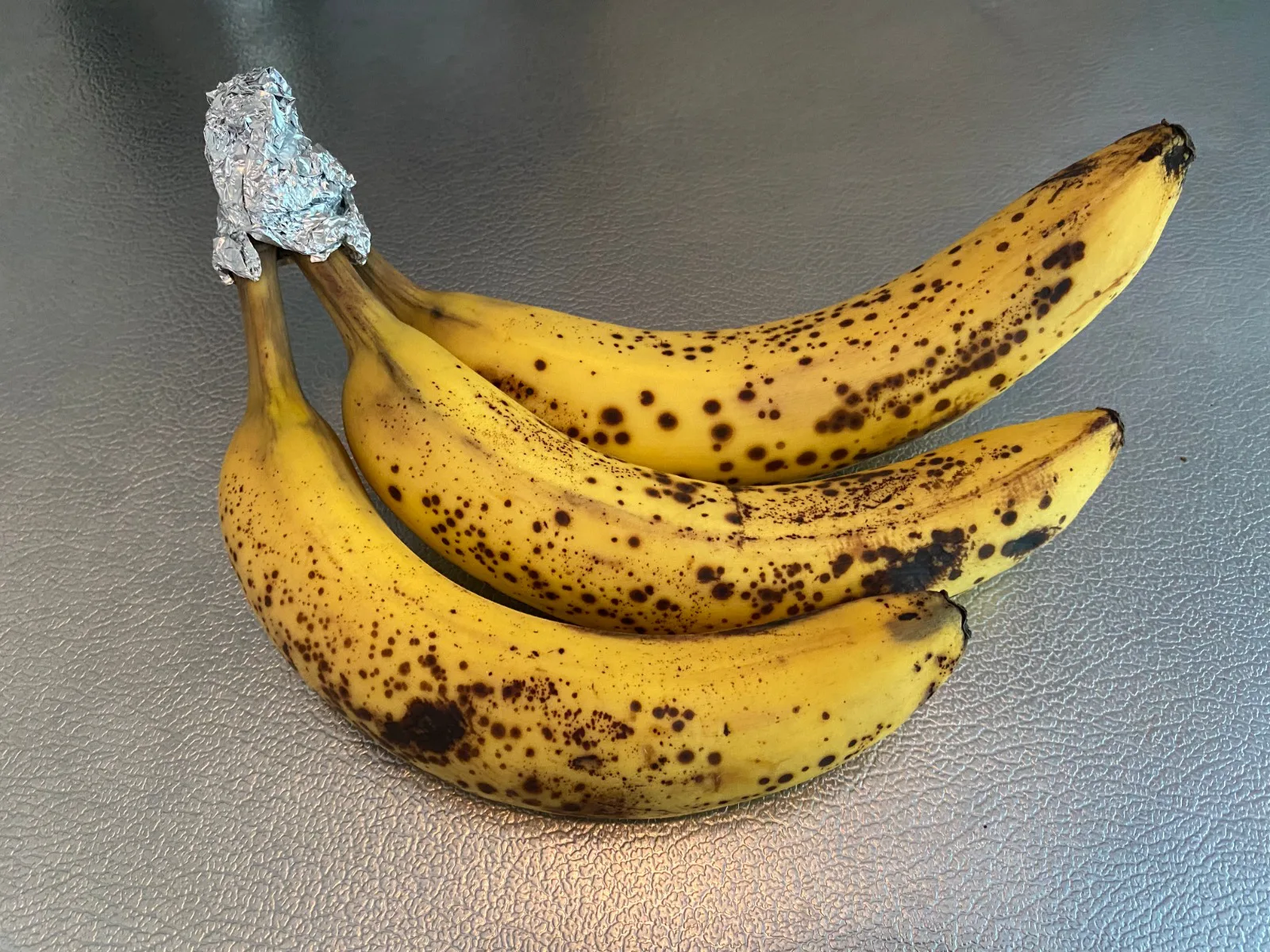 bananas with foil on stems