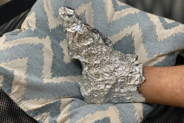 feet wrapped in aluminum foil