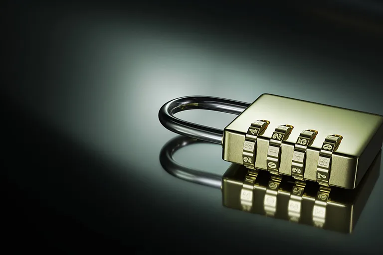 A padlock on a chest